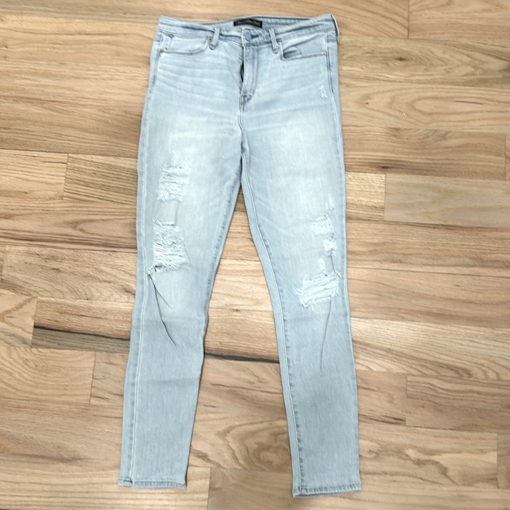 High rise distressed skinny jeans, light wash